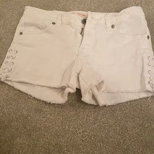 Levi’s white jean shorts with design in the front